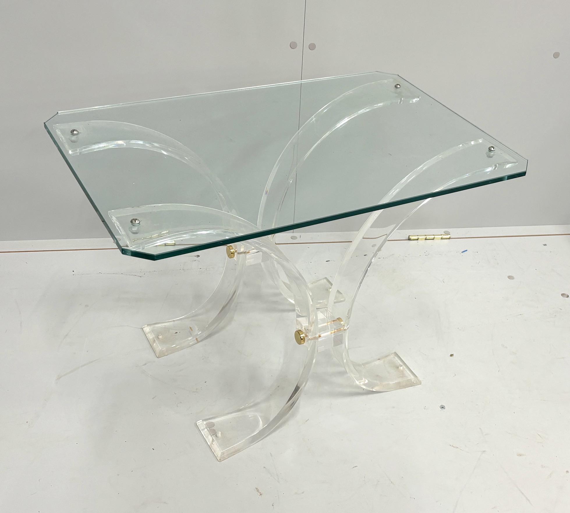 A perspex and glass coffee table, width 69cm, depth 46cm, height 47cm